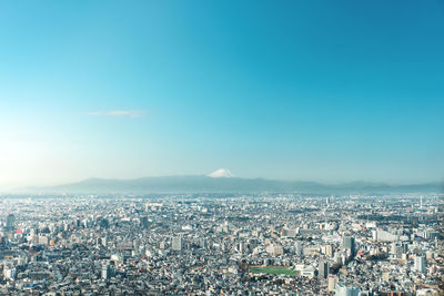 Mountain fuji with cityscape of tokyo skylines. taken from tokyo metropolitan government building