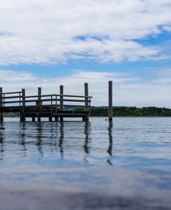 Pier over sea against sky