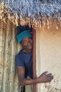 Portrait of smiling man standing outdoors