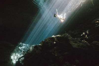 Low angle view of woman underwater