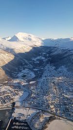 Aerial view of snowcapped mountains against sky