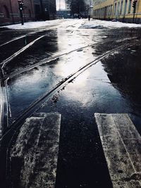 Wet road in city during winter
