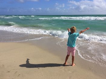 Woman standing on beach