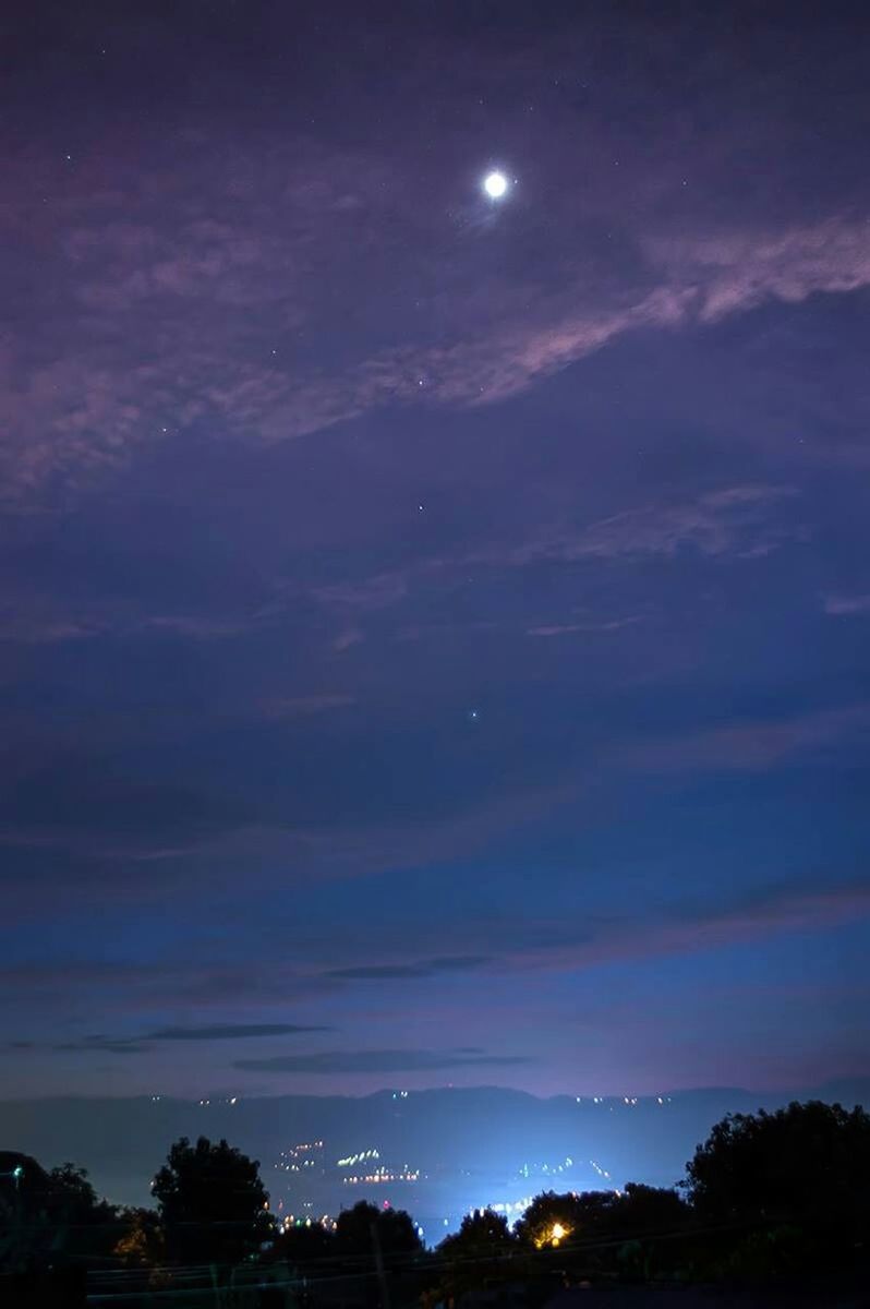 night, sky, illuminated, moon, scenics, low angle view, silhouette, cloud - sky, beauty in nature, building exterior, tree, built structure, dusk, nature, tranquility, architecture, tranquil scene, outdoors, dramatic sky, idyllic