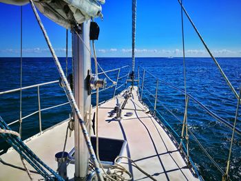 Sailboat sailing on sea against sky