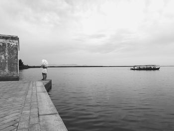 Couple standing by sea