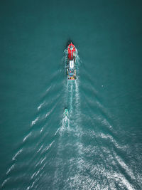 High angle view of people kayaking in sea