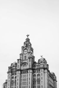 Low angle view of royal liver building against clear sky