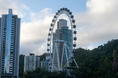 Low angle view of buildings against sky in city