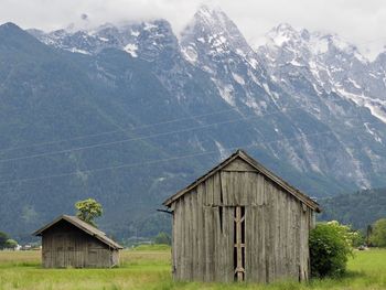 House on mountain against sky