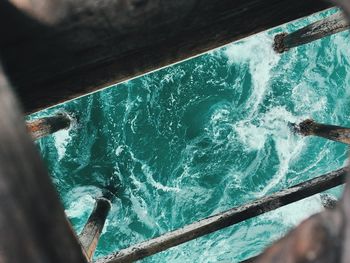 High angle view of water seen through broken jetty