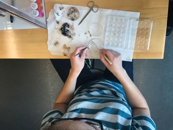 High angle view of woman preparing food at home