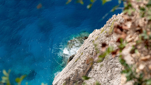 High angle view of rock formation in sea