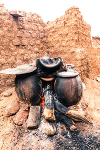 High angle view of millet beer preparing in earthenware pots