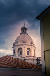 Domed roof of the national pantheon in lisbon against the dramatic clouds