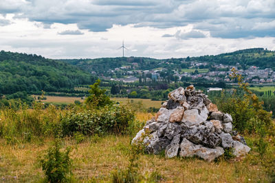 Scenic view of trees and buildings against sky