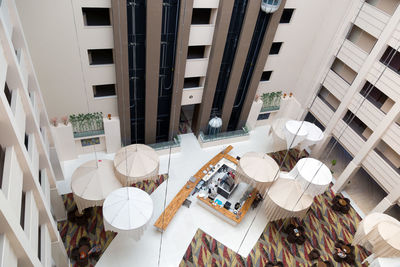 High angle view of chairs and tables in restaurant