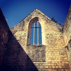 Low angle view of historic building against sky