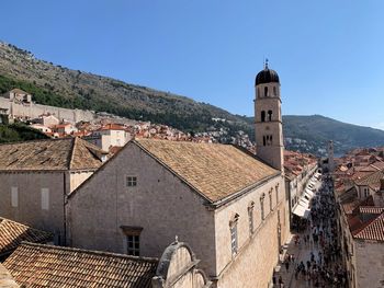 Buildings in town against clear sky