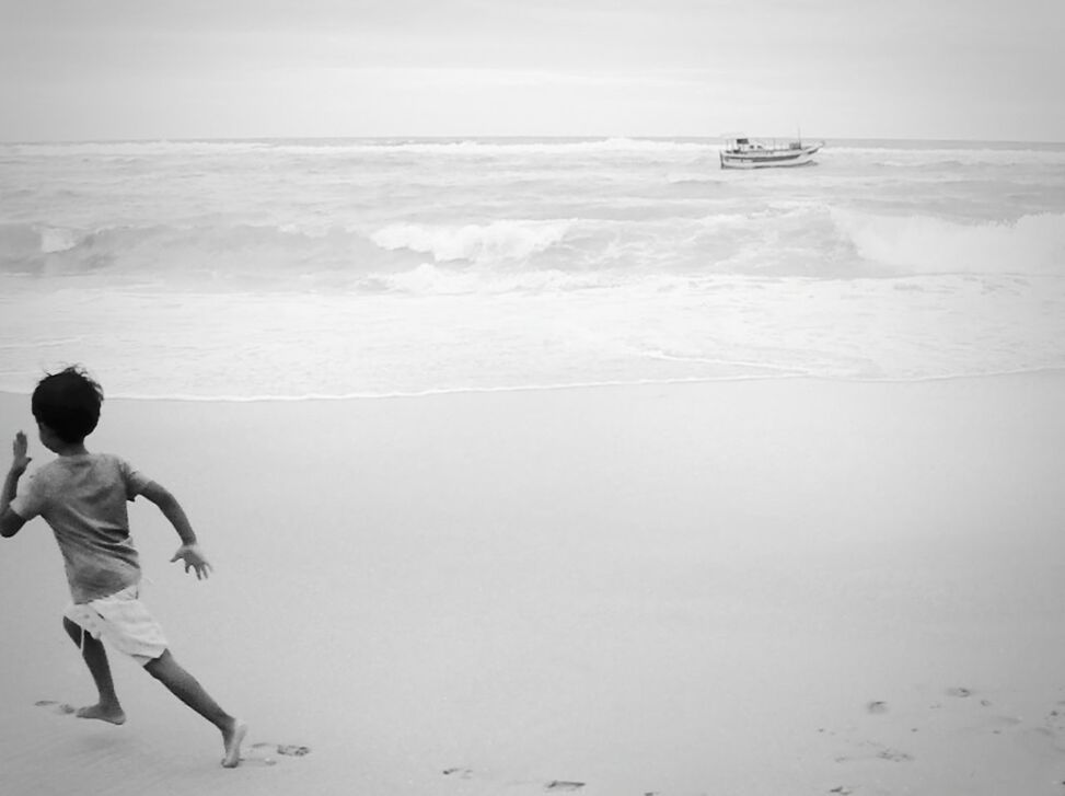 SILHOUETTE OF PEOPLE ON BEACH