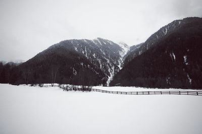 Close-up of snow on mountain against sky