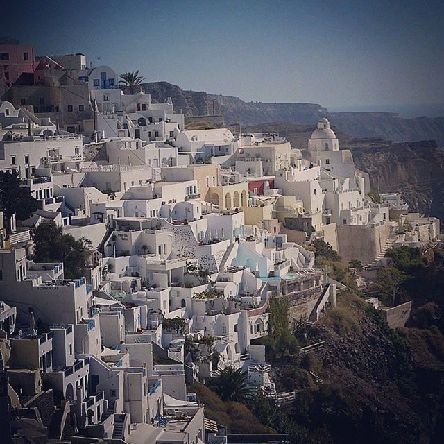 building exterior, architecture, built structure, crowded, residential district, high angle view, town, cityscape, residential structure, townscape, house, residential building, city, roof, clear sky, community, day, outdoors, sunlight, no people