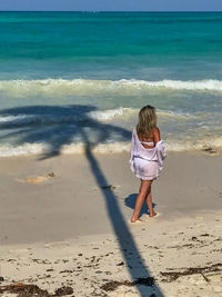 Rear view of woman on beach