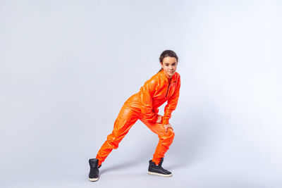 Portrait of girl standing against white background