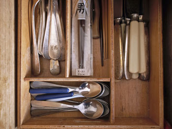 Directly above view of cutlery in drawer