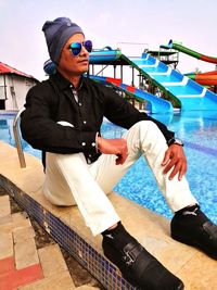 Full length of young man in swimming pool