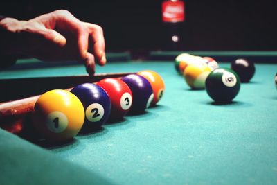 Person playing with ball on table