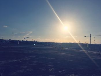 Scenic view of vapor trails against blue sky