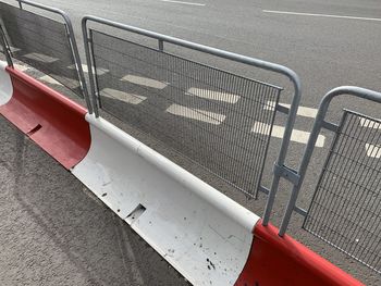 High angle view of empty road by railing