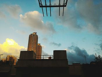 Low angle view of building against cloudy sky