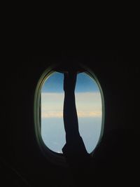 Silhouette of airplane window