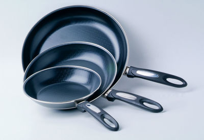 Close-up of cooking utensils on white background