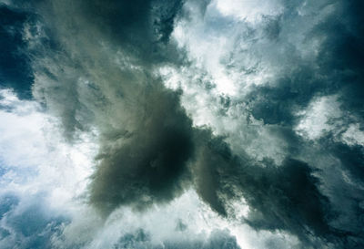 Low angle view of cloudy sky over sea