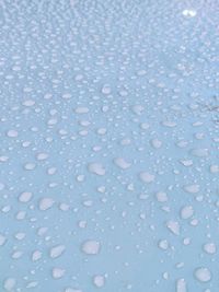 Full frame shot of wet glass during winter