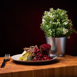 Traditional finnish cuisines. sautéed reindeer on a plate with lingoberry jam and picles on the side