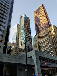 Low angle view of tall buildings against sky