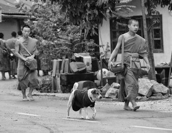 Portrait of man walking with dog