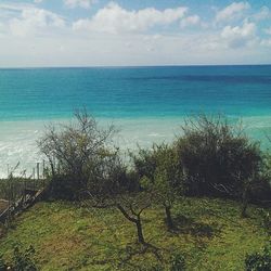 Scenic view of sea against cloudy sky