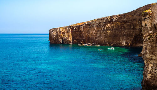 Comino coastline with limestone rocks, sand and the blue lagoon bay, comino island, malta