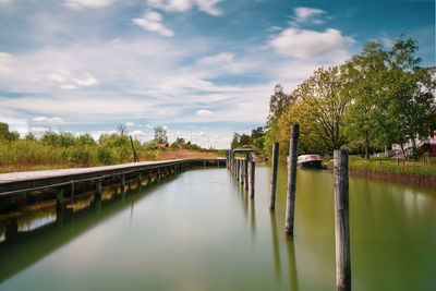 Bridge over lake against sky