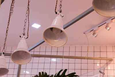 Low angle view of pendant lights hanging from ceiling