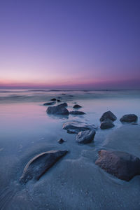 Scenic view of calm sea at sunset