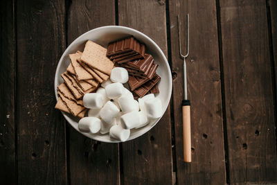 Chocolate, marshmallows and graham crackers for making s'mores table