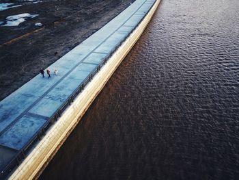 High angle view of man on road by sea