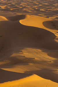 High angle view of sand dunes at beach