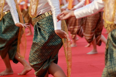 Women wearing traditional clothing dancing